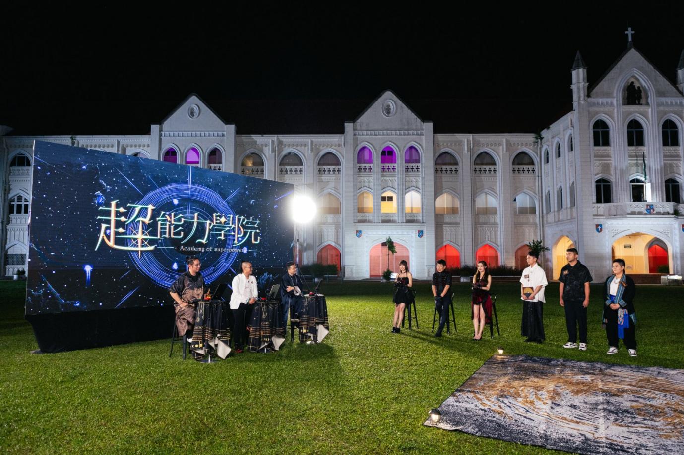 A group of people performing in front of a large screen

AI-generated content may be incorrect.